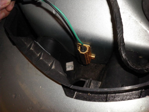 Position the resistor to the clean, flat area beneath the Tail Lamp Assembly area
